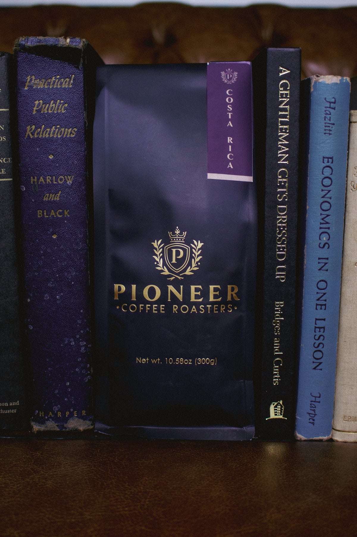 Pioneer Coffee Roasters Costa Rica Las Lajas Natural Black Diamond coffee 300g bag on a bookshelf